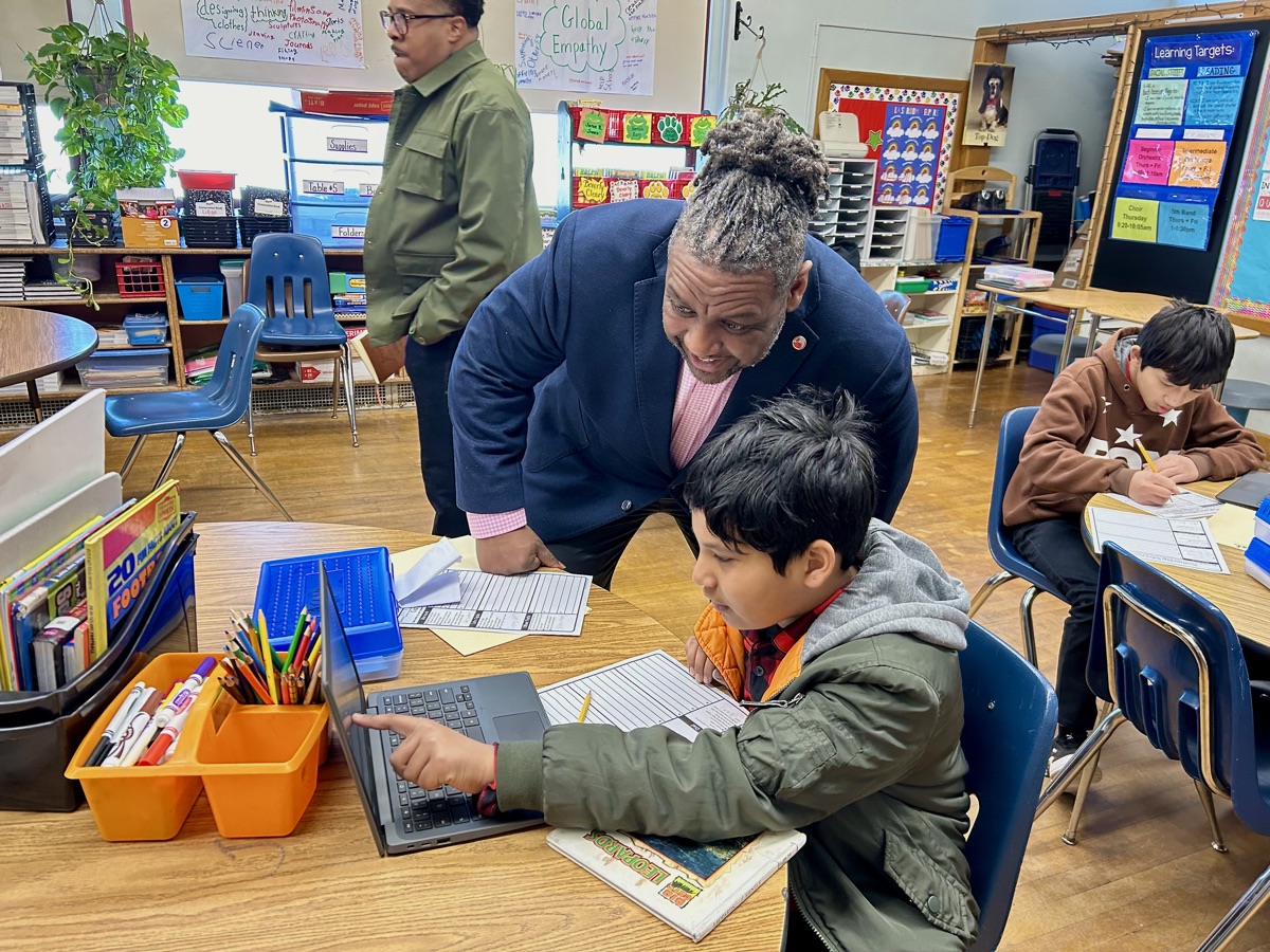 Dr. Grubbs working one-on-one with a student in the classroom