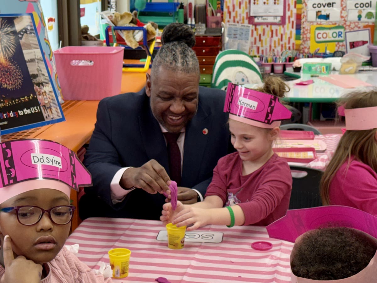 Dr. Grubbs engaging with students during a classroom visit