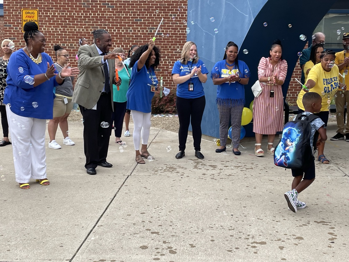 Dr. Grubbs welcoming students at a back-to-school community event